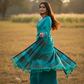 Turquoise checked saree twirling in nature